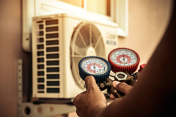 Professional Air Conditioning Service technician working in Medford, NY
